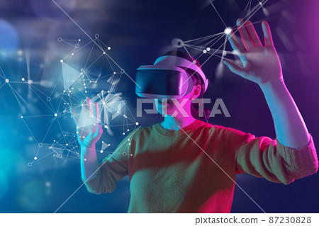 Woman with VR virtual reality goggles Woman with VR virtual reality goggles 87230828