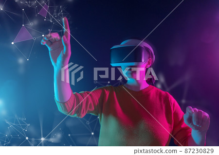 Woman with VR virtual reality goggles Woman with VR virtual reality goggles 87230829
