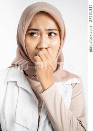 worried muslim asian woman gesture on isolated background worried muslim asian woman gesture on isolated background 87231513