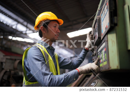Industrial Engineers in Hard Hats.Work at the Heavy Industry Manufacturing Factory. 87231532