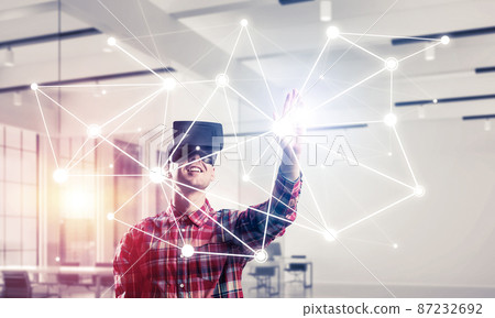 Guy wearing checked shirt and virtual mask reaching hand to touch screen Guy wearing checked shirt and virtual mask reaching hand to touch screen 87232692