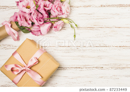 wrapped pink eustoma flower gift box white old table wrapped pink eustoma flower gift box white old table 87233449