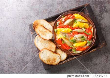 Escalivada Smoky Slow Roasted Vegetables pepper, eggplant, onion closeup in the wooden board. Horizontal top view Escalivada Smoky Slow Roasted Vegetables pepper, eggplant, onion closeup in the wooden board. Horizontal top view 87234765
