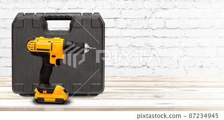 Yellow electric cordless screwdriver drill with box 87234945