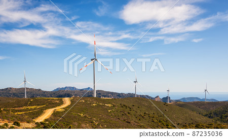 Turbines in a mountain wind farm. Ecological energy production. 87235036