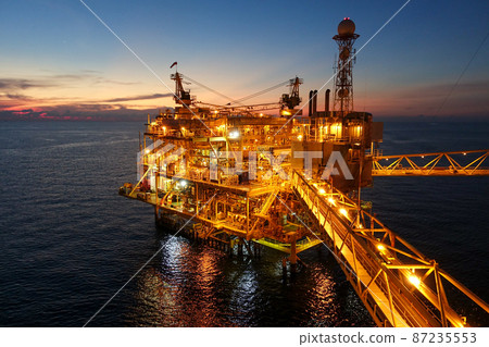 platform for exororation and production oil and gas with bridge in evening time for power energy of the wolrd concept platform for exororation and production oil and gas with bridge in evening time for power energy of the wolrd concept 87235553