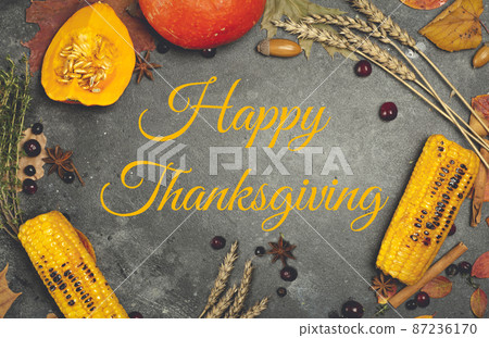 Happy Thanksgiving lettering on a festive dinner background. Food table background with autumn seasonal specialties for Thanksgiving Day. Fried chicken with pumpkin, vegetables and autumn decor Happy Thanksgiving lettering on a festive dinner background. Food table background with autumn seasonal specialties for Thanksgiving Day. Fried chicken with pumpkin, vegetables and autumn decor 87236170