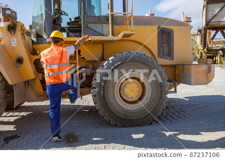 Experienced foreman with hard hat in factory 87237106
