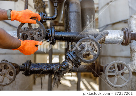 Construction engineer working with equipment in plant Construction engineer working with equipment in plant 87237201