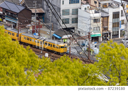EOSRP. Hiroshima Onomichi, telephoto and yellow train approaching. 87239180
