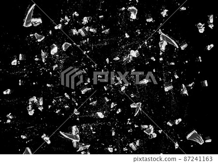 Illustration of broken glass scattered in the dark 87241163