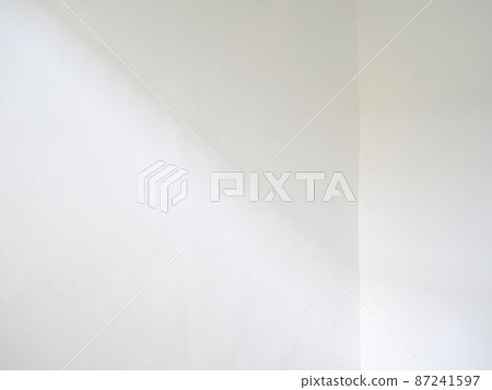 Window shadow and light blur abstract background on white wall Window shadow and light blur abstract background on white wall 87241597