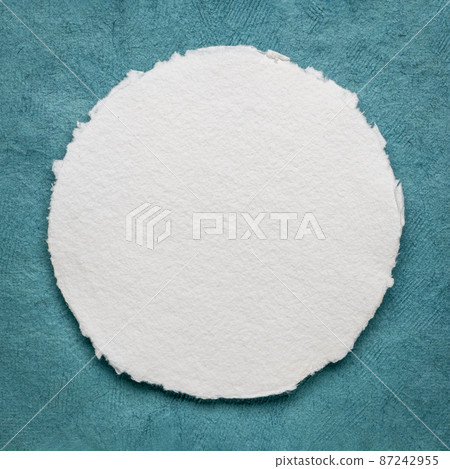 circular sheet of blank white watercolor paper 87242955