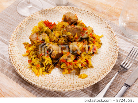 Plate of braised sauerkraut with fried pork meat Plate of braised sauerkraut with fried pork meat 87243583
