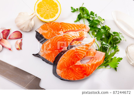 Fresh sliced steaks of salmon 87244672