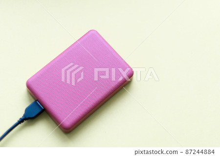 External hard drive disc with usb 3.0 cable. data storage on portable hdd. backup of important data. copy space External hard drive disc with usb 3.0 cable. data storage on portable hdd. backup of important data. copy space 87244884