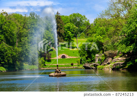 View of a lake with Snake Fountain in Sofiyivka park in Uman, Ukraine 87245213