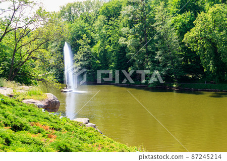 View of a lake with Snake Fountain in Sofiyivka park in Uman, Ukraine 87245214