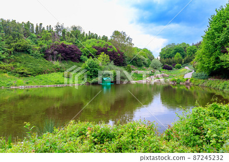 View of pond in Sofiyivka park in Uman, Ukraine View of pond in Sofiyivka park in Uman, Ukraine 87245232