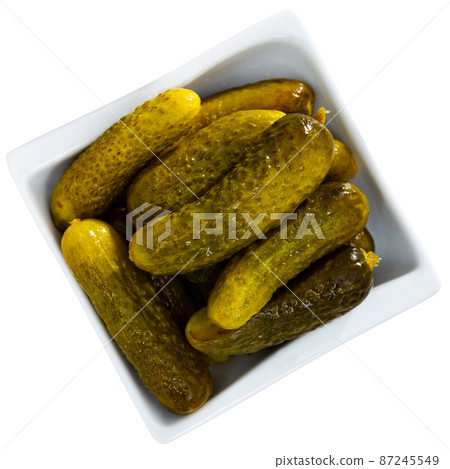 Pickled cucumbers on a ceramic plate 87245549