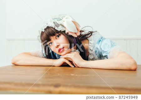 A woman lying down at a desk Cosplay A woman lying down at a desk Cosplay 87245949