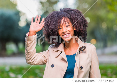 Dominican Republic young student woman headshot. Winter lifestyle afro hair Latin portrait 87246308