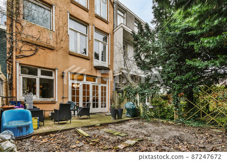 Large house with a garden in the backyard Large house with a garden in the backyard 87247672