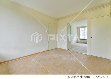 interior of an old style empty room with wooden floor 87247894