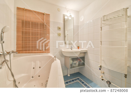 Luxury interior design of a bathroom with marble walls Luxury interior design of a bathroom with marble walls 87248008