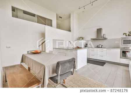 Kitchen in a new luxury home, hardwood floors, dark cabinets 87248176