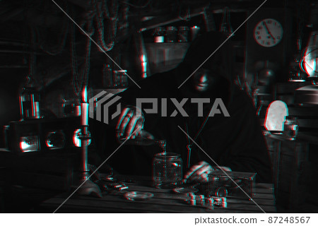 man in alchemist's costume in laboratory with jars by candlelight. Cosplay of computer game character with 3D glitch effect of virtual reality 87248567
