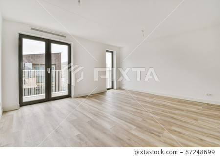 interior of bright empty room with doors entering to the balcony interior of bright empty room with doors entering to the balcony 87248699