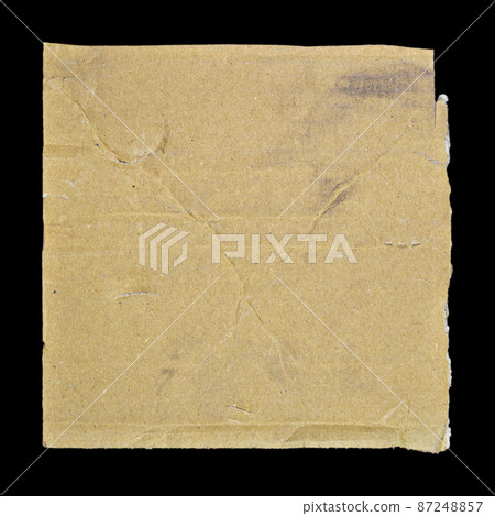 Brown and beige corrugated cardboard detail, isolated on black background Brown and beige corrugated cardboard detail, isolated on black background 87248857