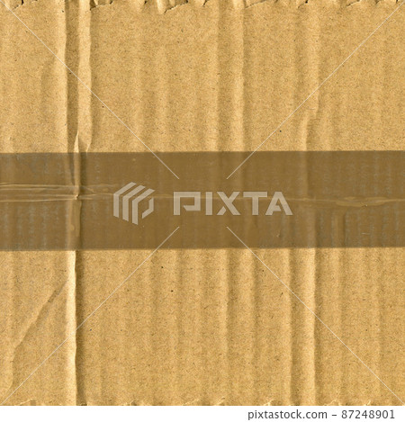 Brown and beige colored corrugated cardboard and duct tape detail Brown and beige colored corrugated cardboard and duct tape detail 87248901