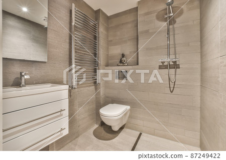 Interior of small clean restroom in miniature style 87249422