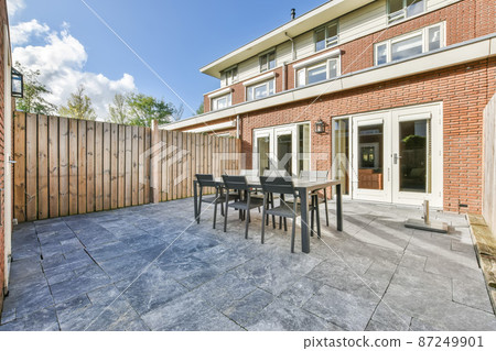Large backyard with no trees or plants,Outdoor dining area 87249901