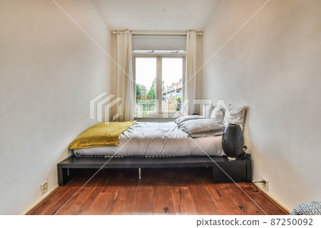 Beautiful bedroom in new luxury home with some decor 87250092