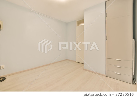 semi-empty room with a closet for storage and other things 87250516