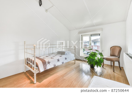 Modest bedroom for one person in a minimalist style Modest bedroom for one person in a minimalist style 87250644