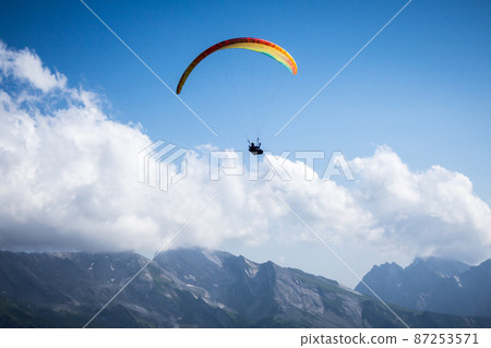 paragliding flight in the mountains. Le Grand-Bornand, France 87253571