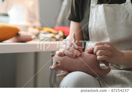 process of making handmade toys. Handicraft, hobby, unique job concept process of making handmade toys. Handicraft, hobby, unique job concept 87254237