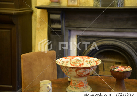 Plate and fireplace on the table Plate and fireplace on the table 87255589