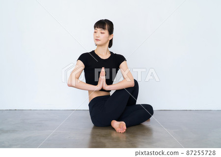woman doing yoga indoors 87255728