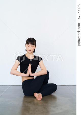 woman doing yoga indoors woman doing yoga indoors 87255729