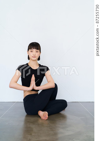 woman doing yoga indoors 87255730