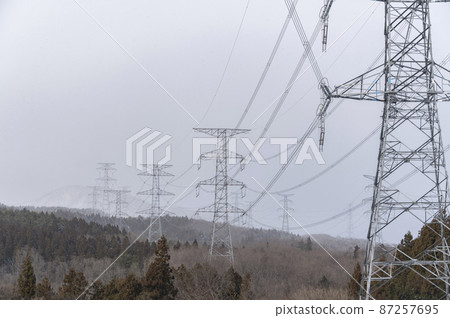 Towers and power lines in the snow Towers and power lines in the snow 87257695