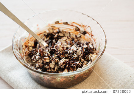 Making chocolate bar for oatmeal Making chocolate bar for oatmeal 87258093