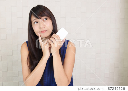 Woman with smartphone Woman with smartphone 87259326