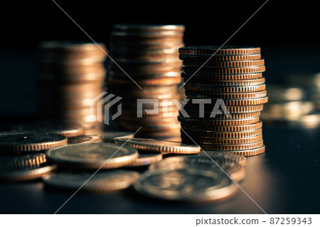 Pile of gold coins money stack in finance treasury deposit bank account saving 87259343