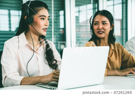 Business people wearing headset working actively in office 87261269